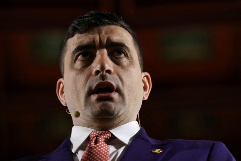 Far-right opposition leader and presidential candidate George Simion holds a press conference in Bucharest