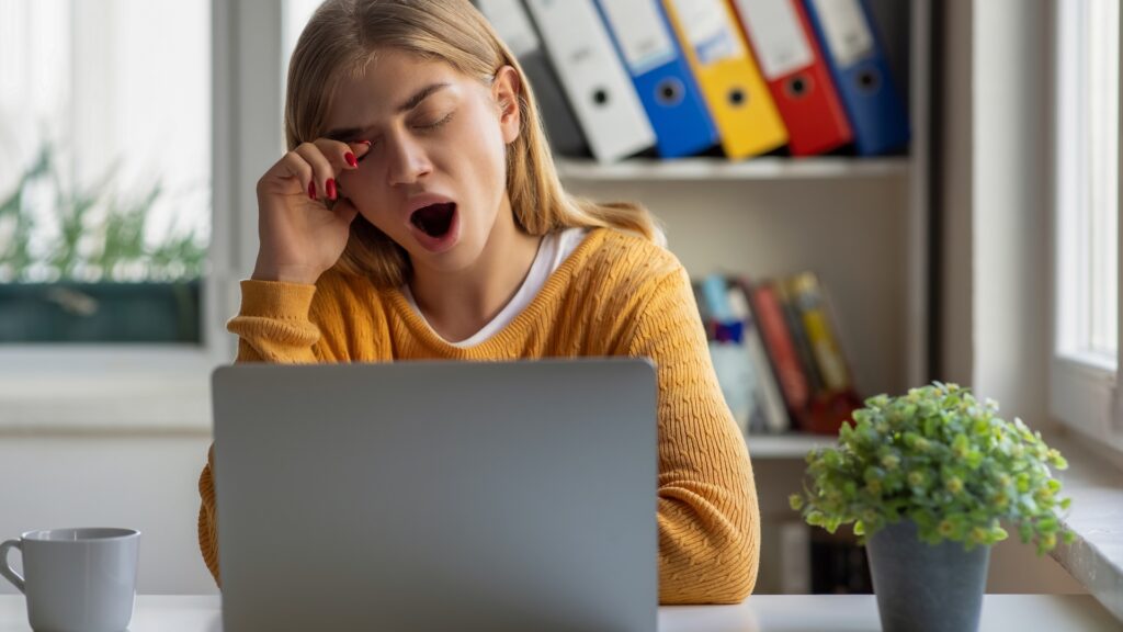 Woman bored and yawning